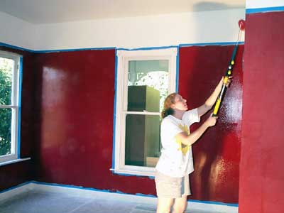 [photo of kris painting the study]