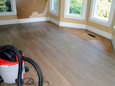[The unfinished floors in the parlor]