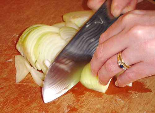 Kris is demonstrating her unstoppable onion technique. This is the knife I convinced her to buy me for my birthday.