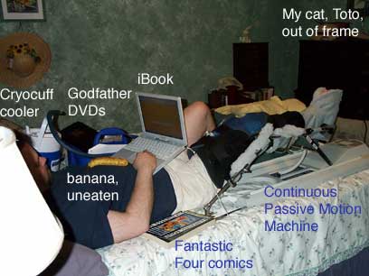 [photo of me on bed with all my doo-dads]
